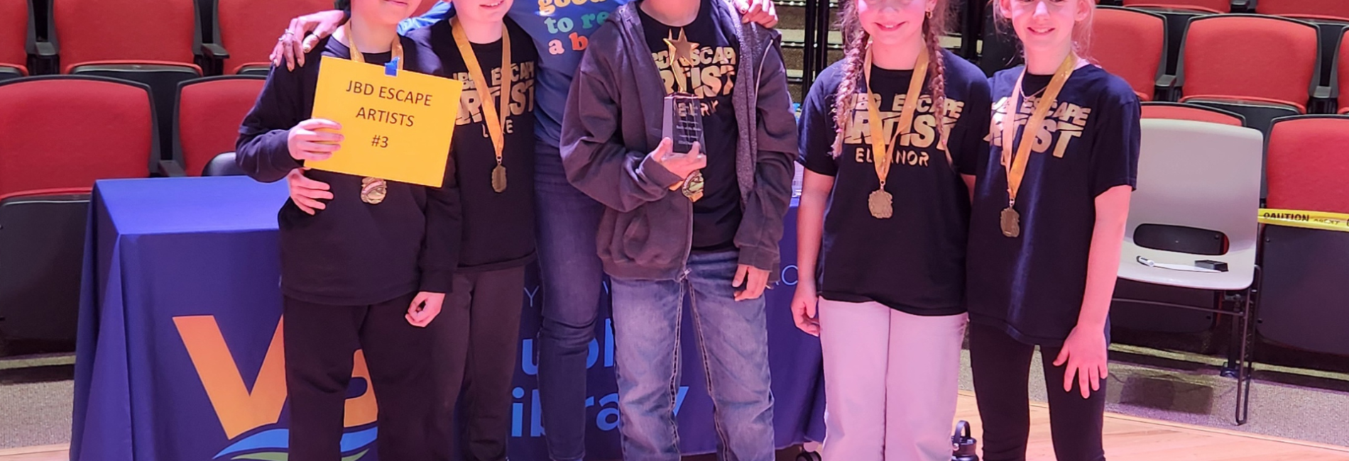 A group of cheering 5th grade winners battle of the Books 2024