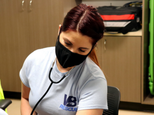 Paramedic Taking Blood Pressure