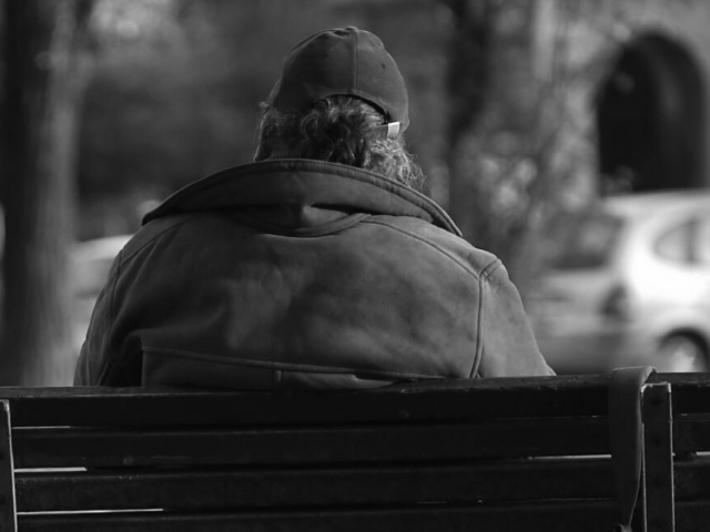 Homeless Person on Park Bench