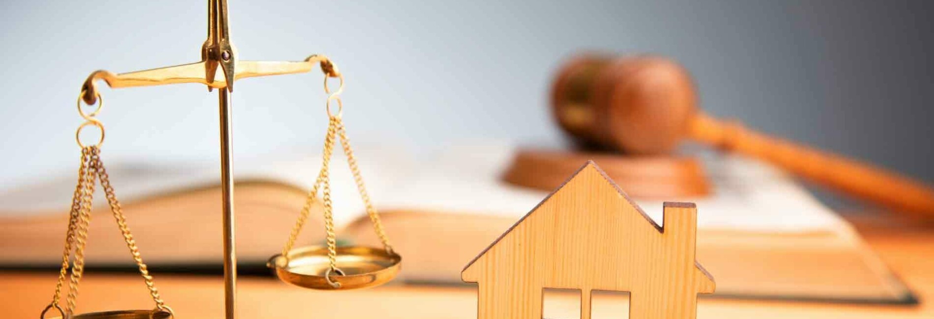 House with Law Scales on Desk