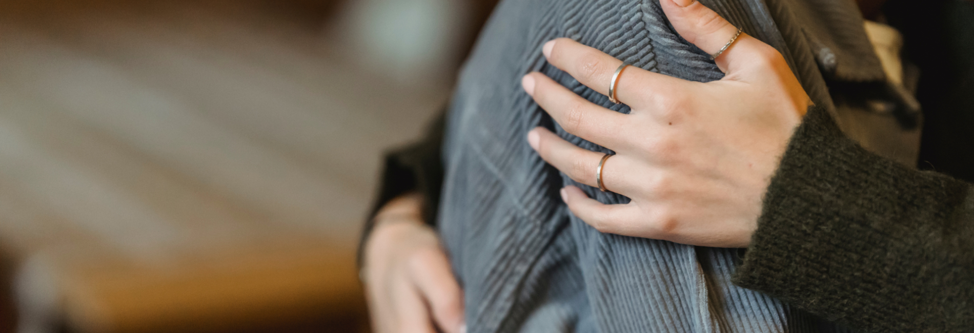 Person hugging and comforting individual in distress