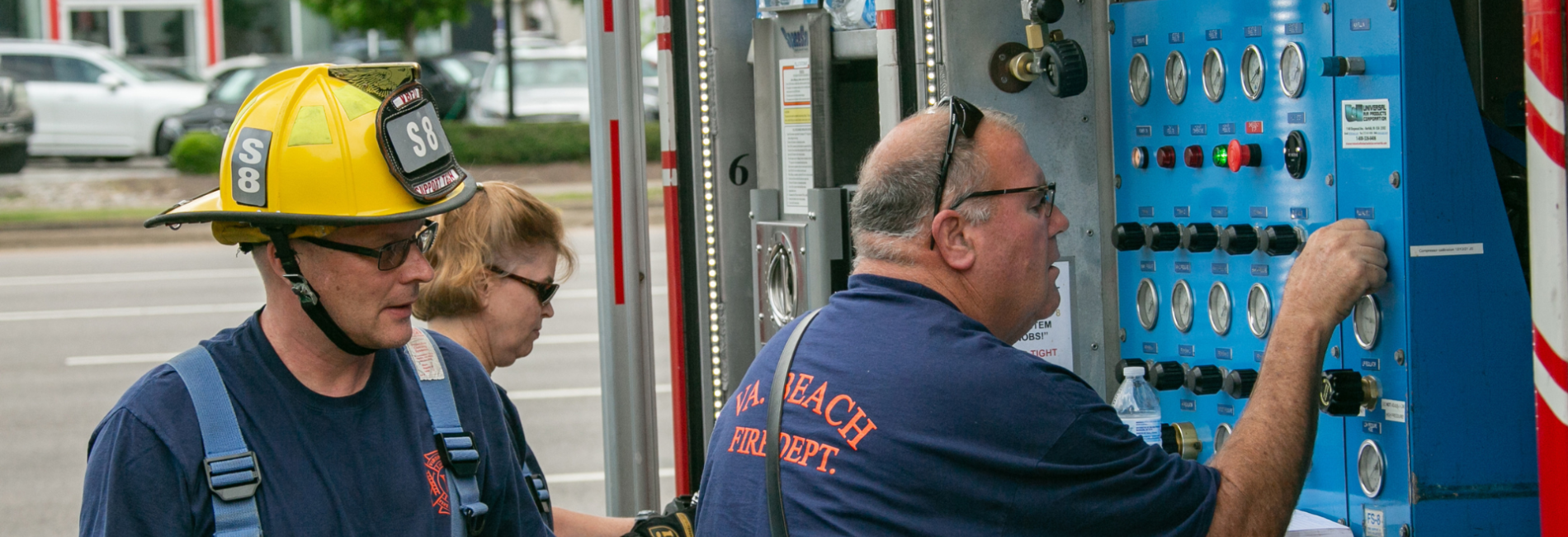 Firefighter checking equimpent on truck